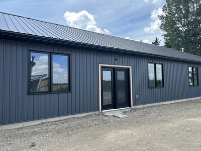 showing the large double door entrance into the office 